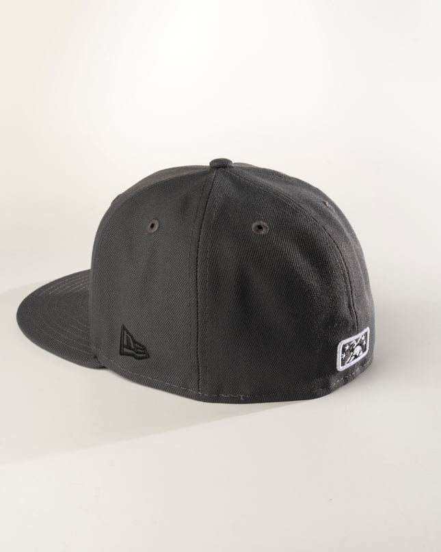 Rear profile of a graphite crown with green undervisor New Era Charleston Charlies 59Fifty fitted hat with a white logo on the front.