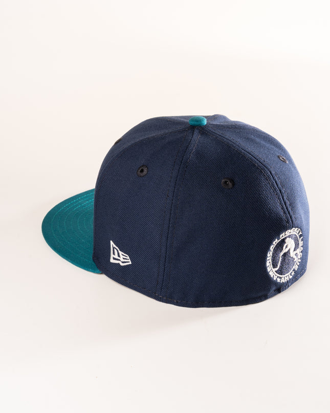 Rear profile of New Era hartford Wolf Pack 59Fifty in oceanside blue, with a shark teal visor and grey undervisor.